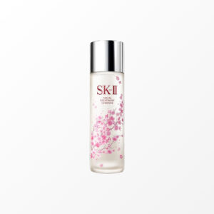 a bottle of cream with pink flowers